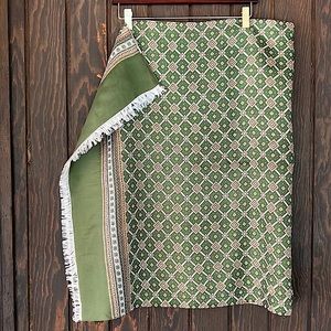 Woman’s olive green, cream, and gold geo print scarf
